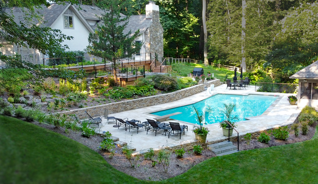 image of pool deck stone wall and landscaping